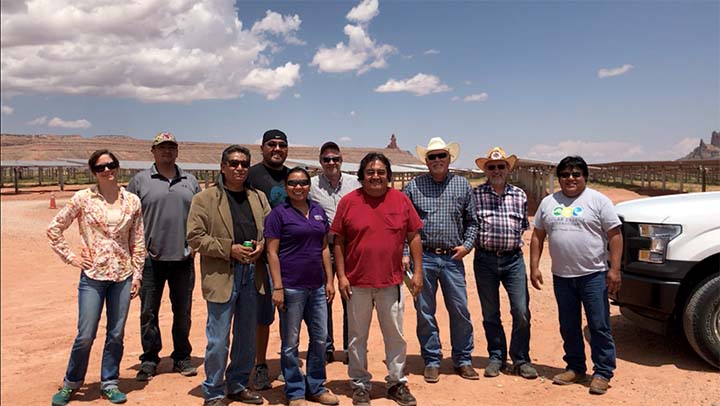 A group of people standing at solar project in Arizona.